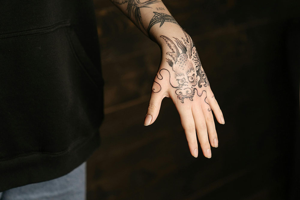 dragon tatto on a female hand