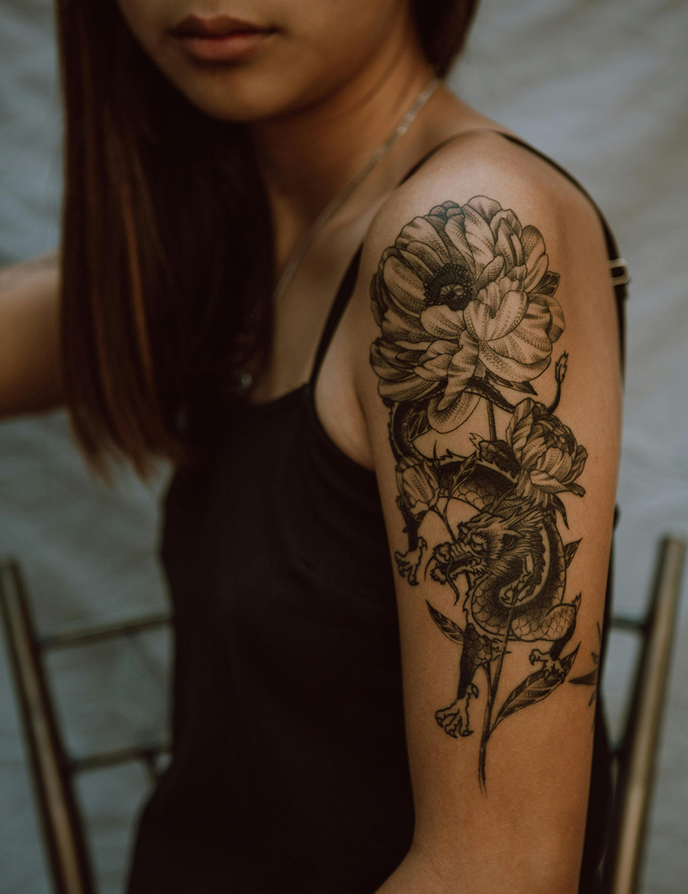 Flower tattoo on female shoulder